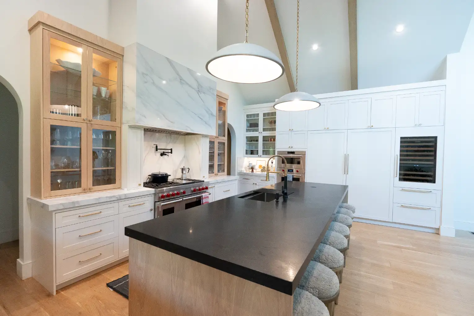 Built-in coffee station and beverage refrigerator in white shaker cabinetry