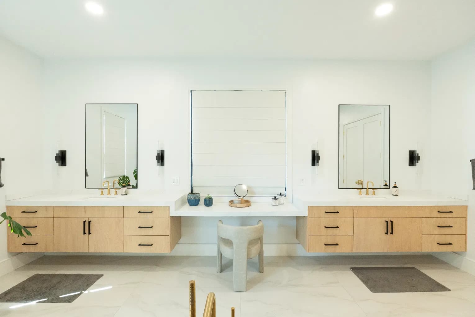 Light oak floating vanity, mitered quartz, gold trim